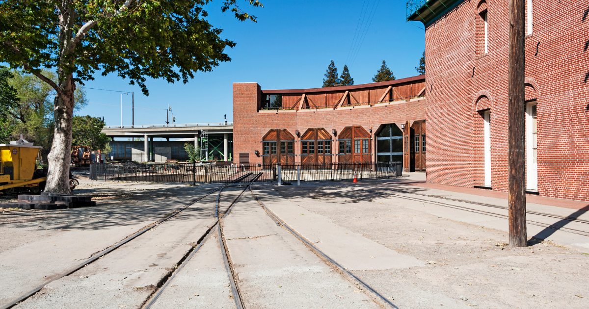 The railroad tracks leading up to the railroad museum
